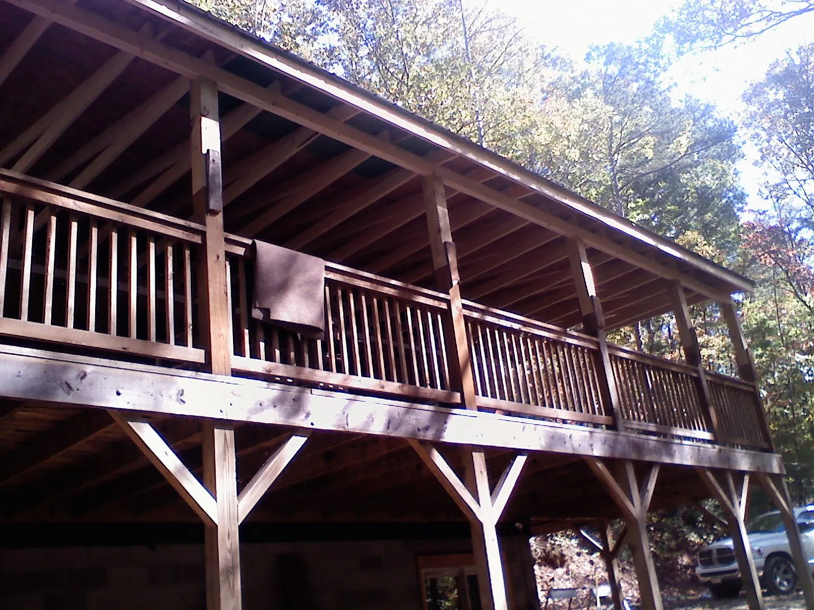 Timber framing under a new elevated porch and deck — Roof Leak Repair in Champion by Roofing Brothers